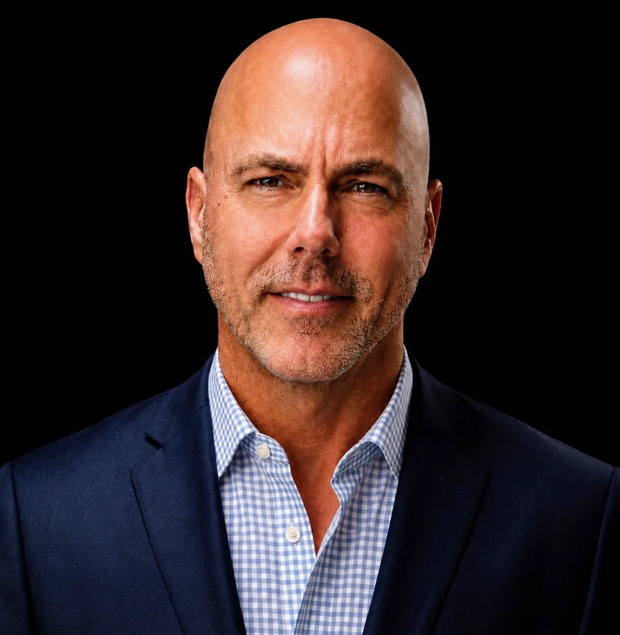 Current portrait of Bob File with a shaved head in a dark jacket.